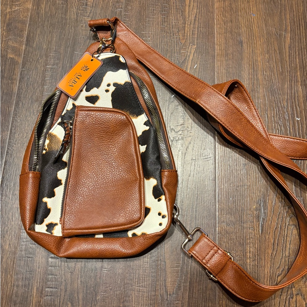 NWT cow sling bag